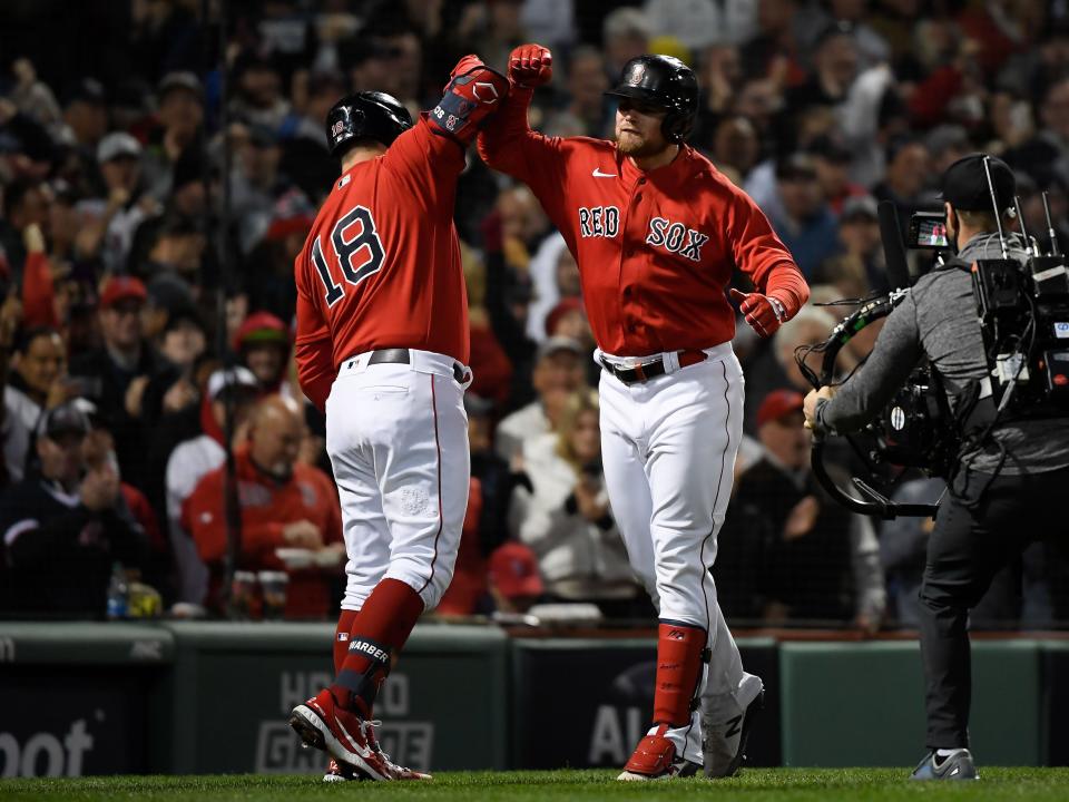 Christian Arroyo (right) celebrates with Kyle Schwarber (18) after hitting a two-run home run against the Houston Astros.