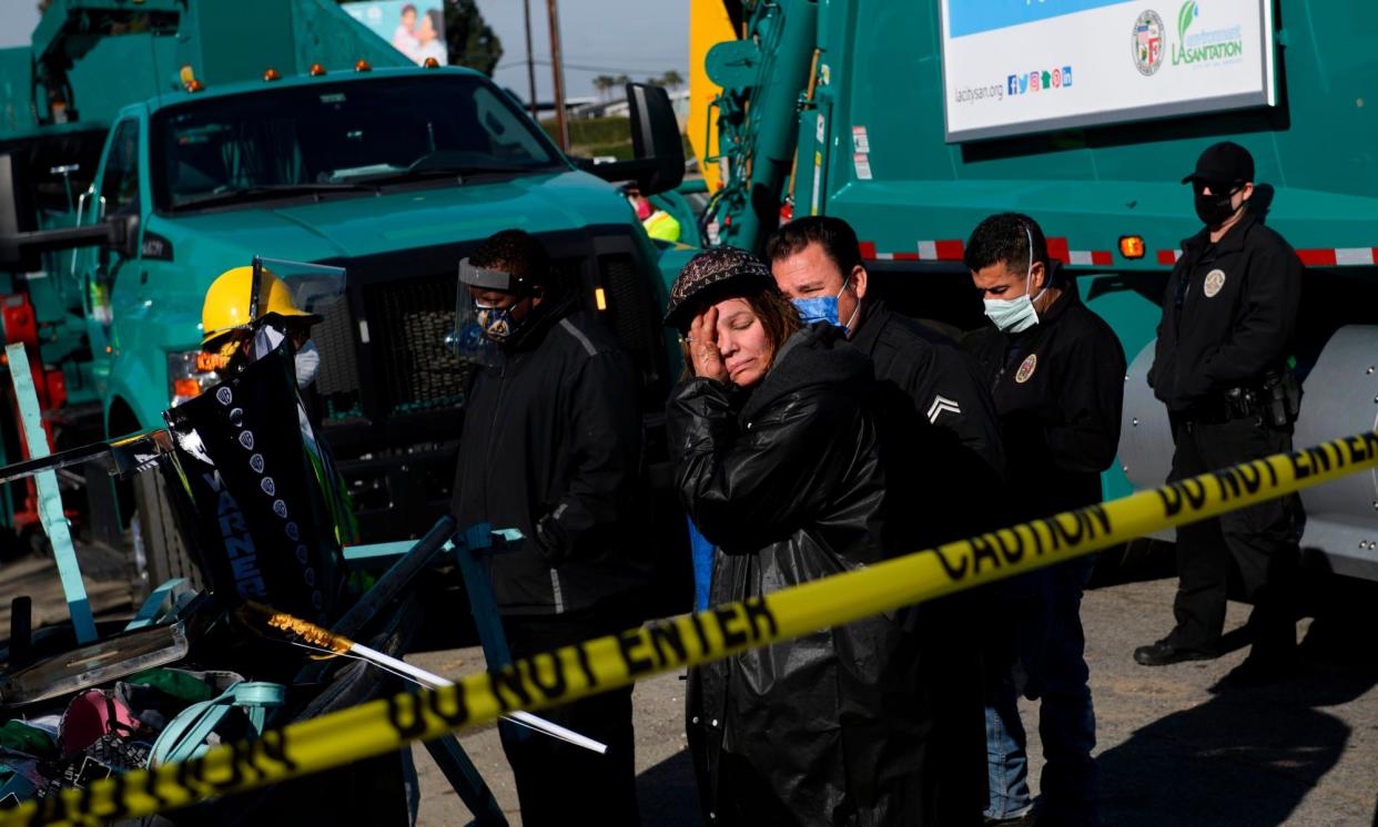 <span>A person reacts as their possessions are seized during a sweep of an encampment in Los Angeles in January 2021. </span><span>Photograph: Patrick T Fallon/AFP/Getty Images</span>