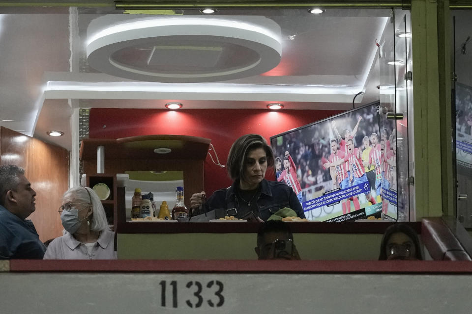 People use a skybox during a soccer match at Azteca Stadium in Mexico City, Wednesday, March 13, 2024. FIFA asks host stadiums for the World Cups to relinquish full control of the building 30 days before the first match and seven days after the last one, including the boxes. (AP Photo/Eduardo Verdugo)