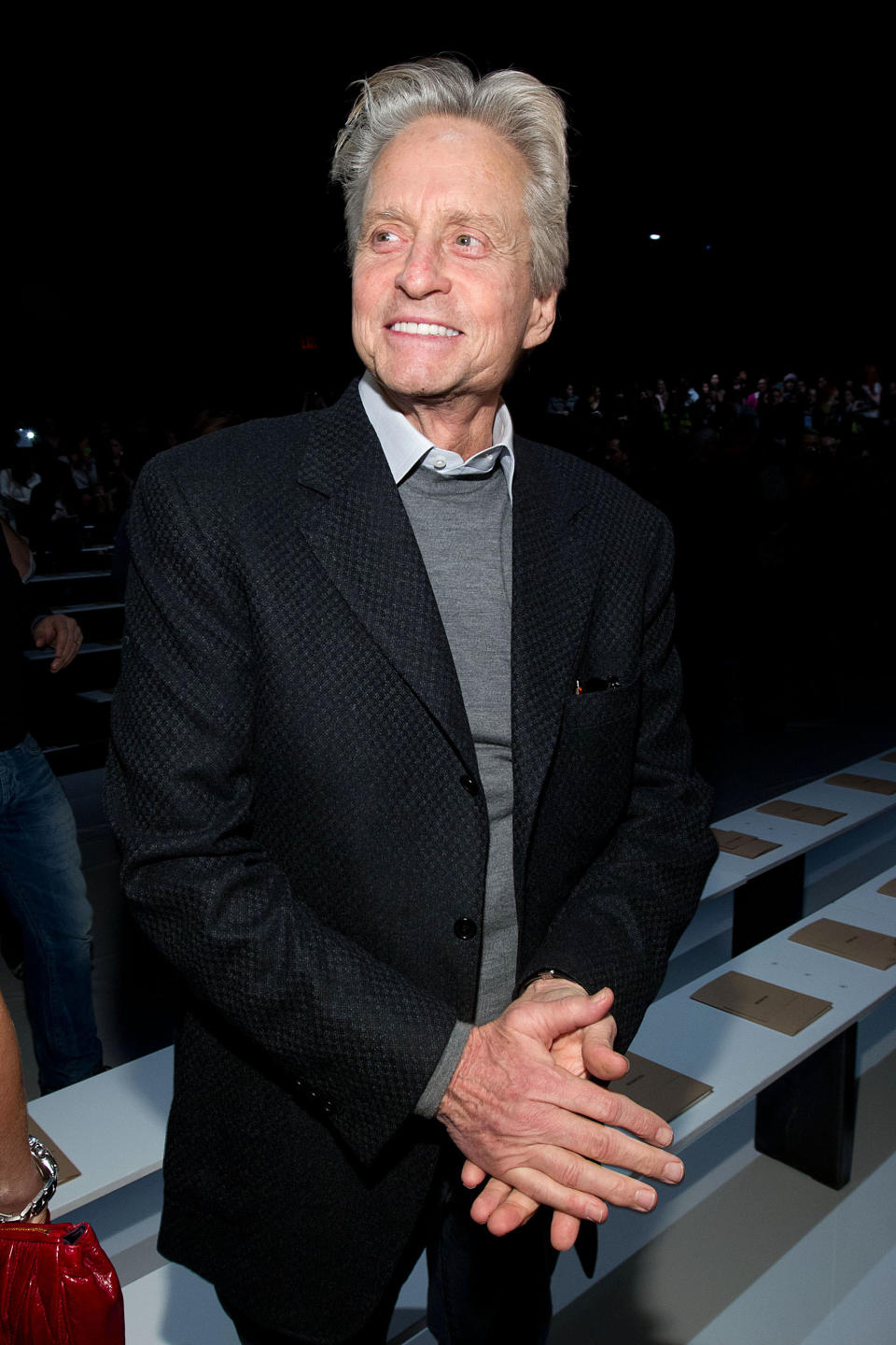 Michael Douglas attends the Fall 2013 Michael Kors Runway Show, on Wednesday, Feb. 13, 2013 in New York. (Photo by Dario Cantatore/Invision/AP)