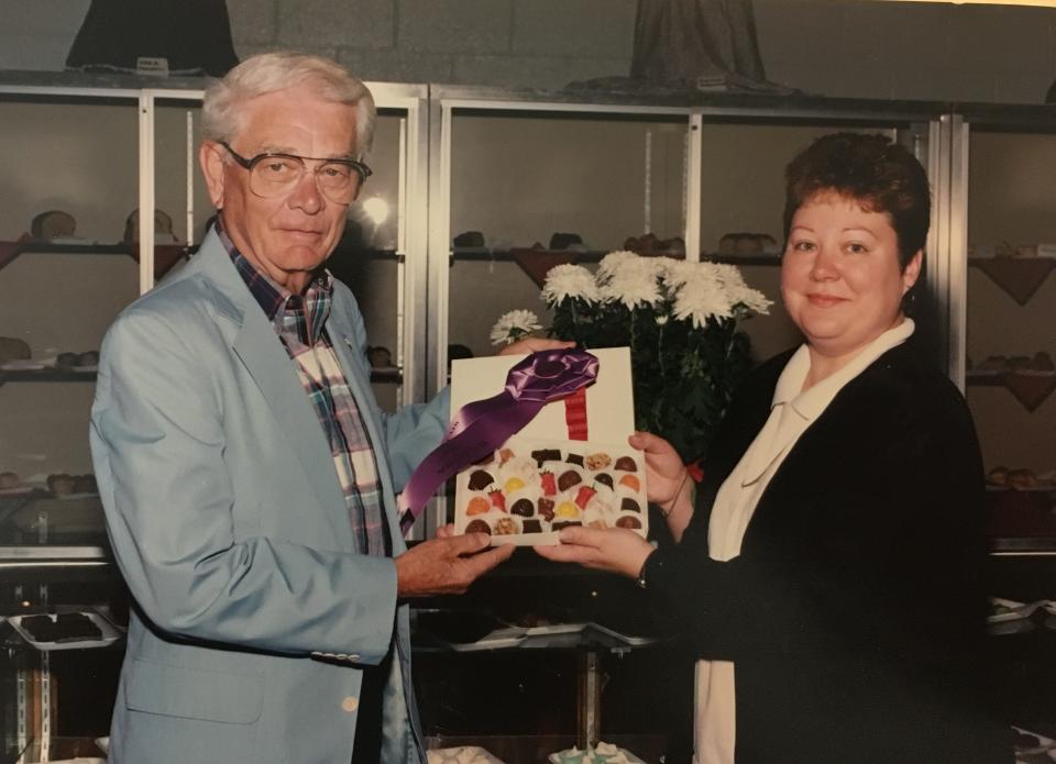Vickie Noble, right, presents her first prize assortment of homemade candy to then-Ohio State Fair Manager Jack Foust in 1988. Noble, who has lived in Harrison Township for nearly 30 years, has won more than 350 awards at the Ohio State Fair since she began competing in 1976.