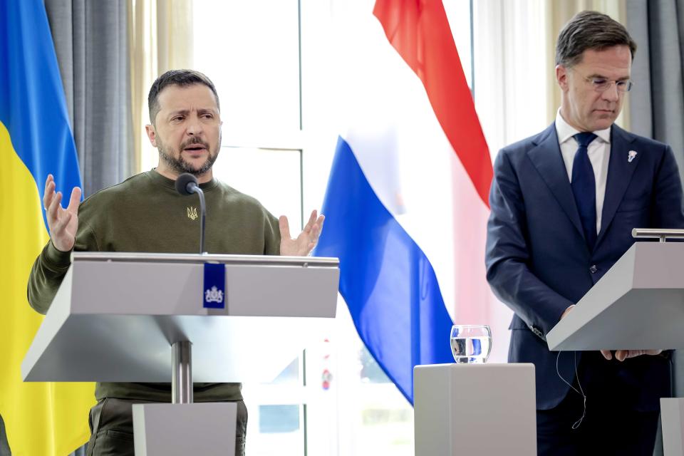 Ukrainian President Volodymyr Zelensky addresses a press conference with Dutch Prime Minister Mark Rutte (EPA)