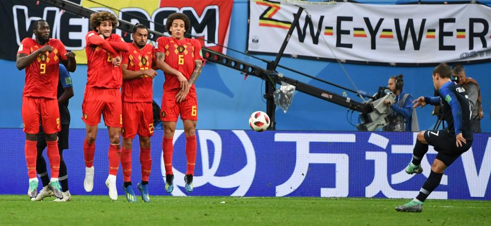 <p>Belgium’s forward Romelu Lukaku, Belgium’s midfielder Marouane Fellaini, Belgium’s midfielder Nacer Chadli and Belgium’s midfielder Axel Witsel jump as France’s forward Antoine Griezmann takes a free kick during the Russia 2018 World Cup semi-final football match between France and Belgium at the Saint Petersburg Stadium in Saint Petersburg on July 10, 2018. (Photo by Paul ELLIS / AFP) </p>