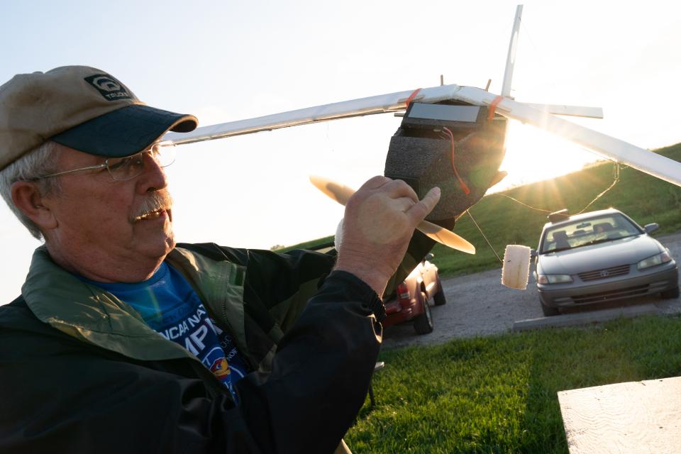 Randy Linderman, a FAE member from Silver Lake, describes how his ultra-light rc plane, called "The Floppy," works. Linderman said a friend of his in Texas designed the plane, which he later built himself.