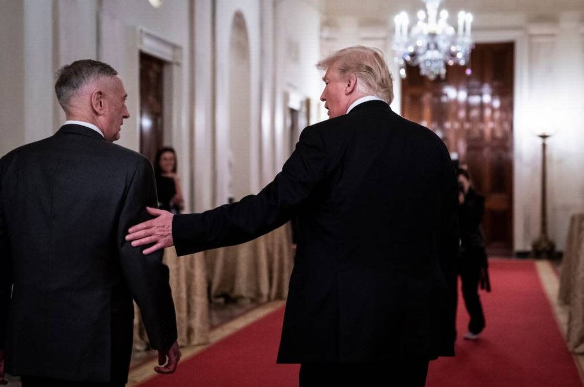 Mattis and President Donald Trump talk after a White House reception in 2018.