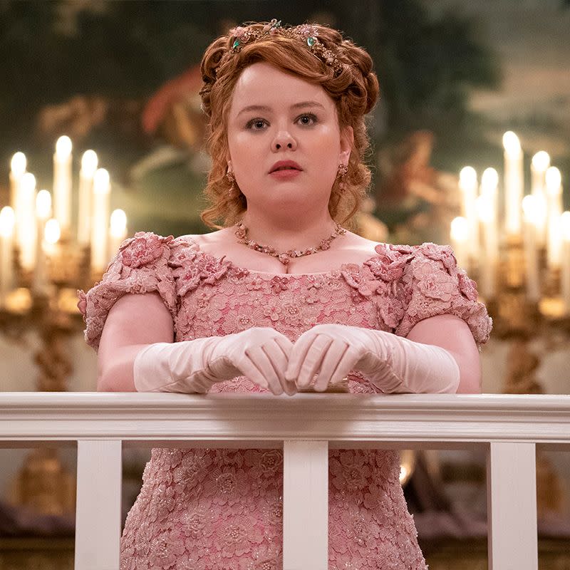 penelope featherington in light pink evening gown with necklace and white gloves in season two bridgerton