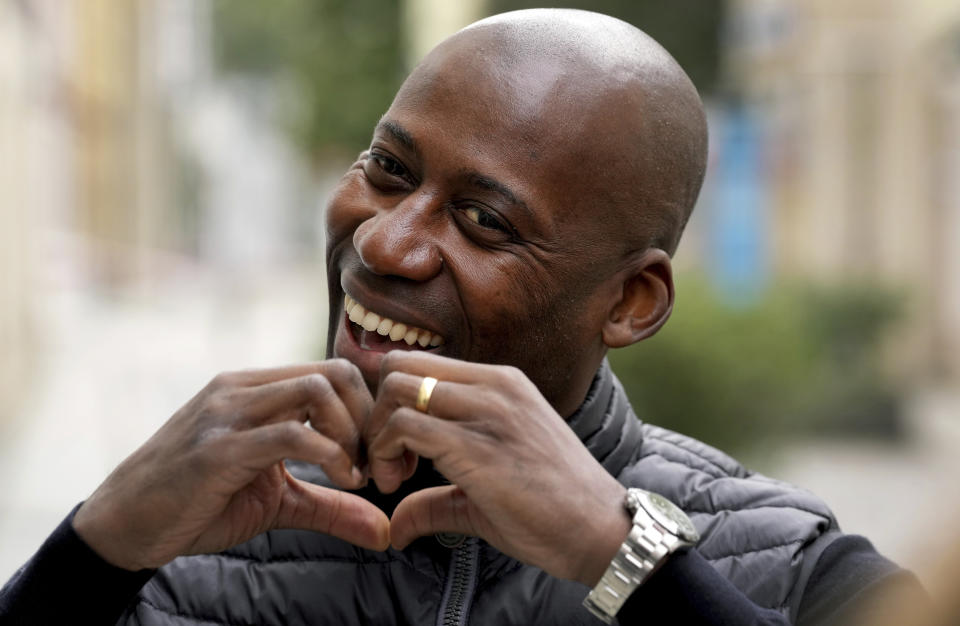 Joe Chialo, whose parents are from Tanzania, candidate of the German Christian Democratic Union, CDU, party for the federal elections, smiles during an interview with the Associated Press in his election district in Berlin, Germany, Sunday, Sept. 19, 2021. Hundreds of immigrants are running in Germany's national election on Sunday, raising the possibility of making its next parliament more diverse than ever. While it still might not fully represent the country's overall diversity, where more than a quarter of the population has immigrant roots, it's a step toward a more accurate reflection of society. (AP Photo/Michael Sohn)