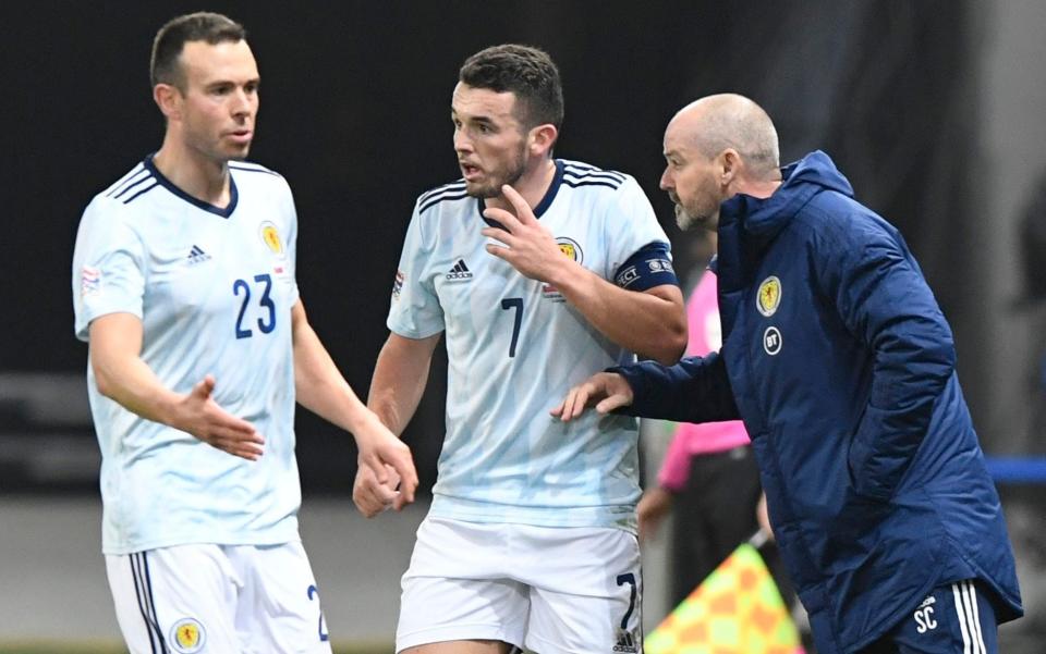 Scotland manager Steve Clarke gives instructions to John McGinn and Andrew Considine - REUTERS