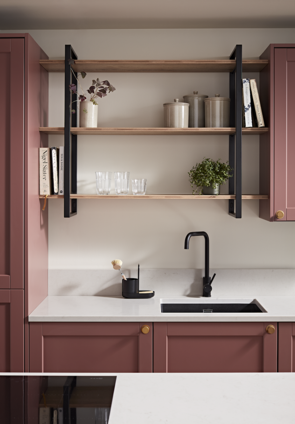 a kitchen with a shelf and cupboards