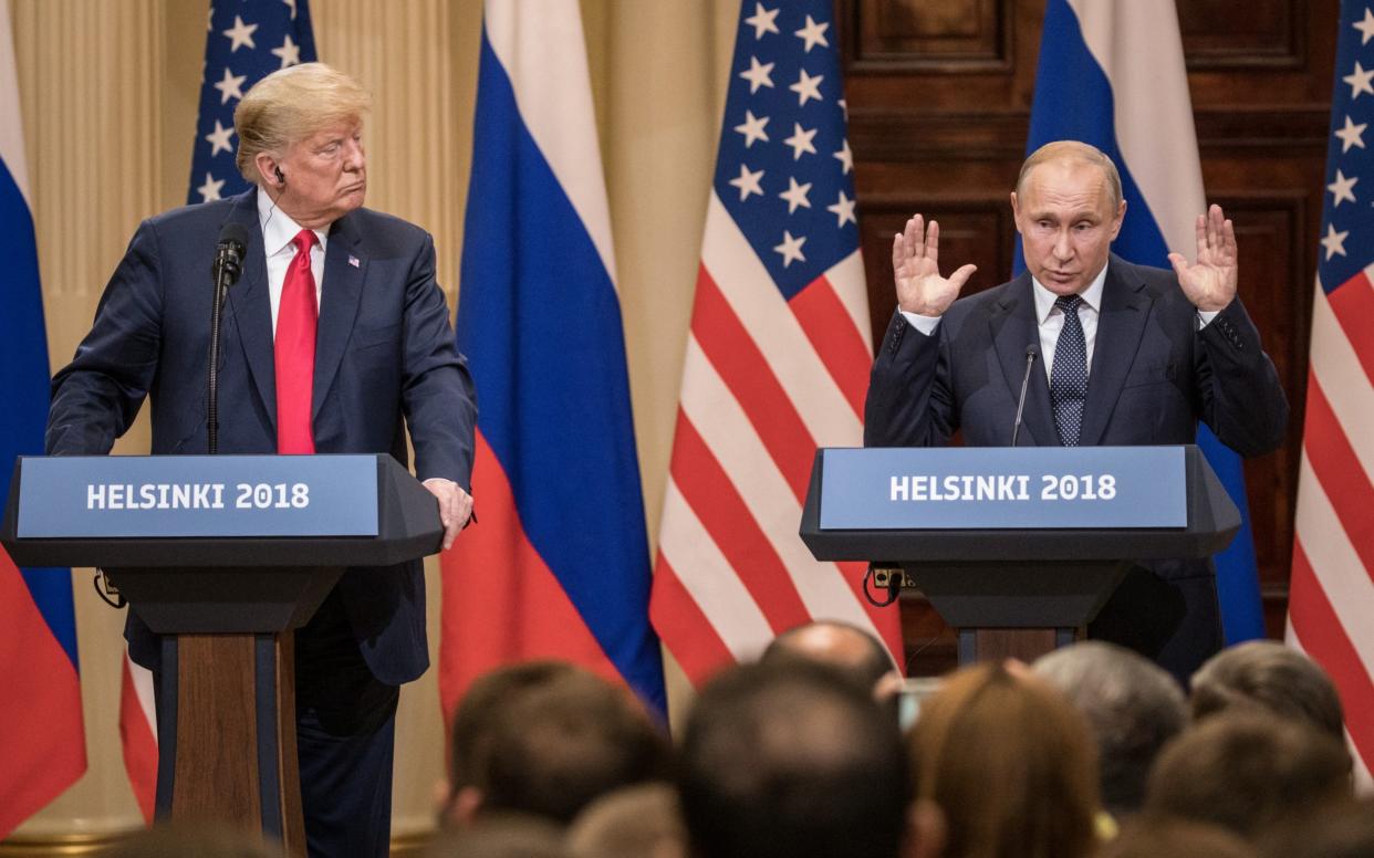 U.S. President Donald Trump (L) and Russian President Vladimir Putin answer questions about the 2016 U.S Election collusion during a joint press conference after their summit on July 16, 2018 in Helsinki, Finland. The two leaders met one-on-one and discussed a range of issues including the 2016 U.S Election collusion - Chris McGrath /Getty Images 