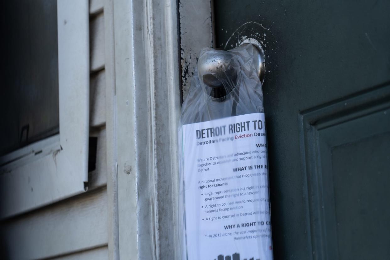 Flyers were left on a door as volunteers hand out literature about federal rent aid at Martin Luther King I & II homes in Detroit on September 24, 2021.