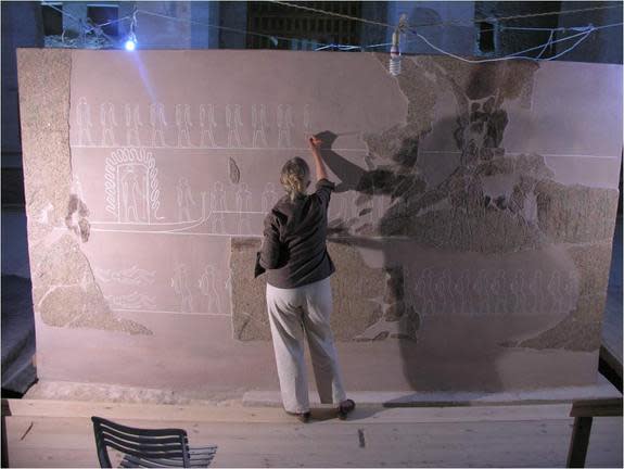 Archaeologist Lyla Pinch Brock at work reconstructing a giant outer sarcophagus box belonging to Egyptian pharaoh Merneptah.