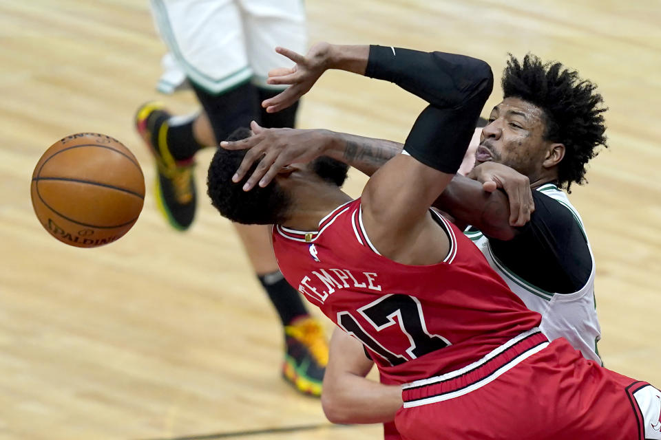 Boston Celtics' Marcus Smart, right, blocks the shot of Chicago Bulls' Garrett Temple during the second half of an NBA basketball game Monday, Jan. 25, 2021, in Chicago. (AP Photo/Charles Rex Arbogast)