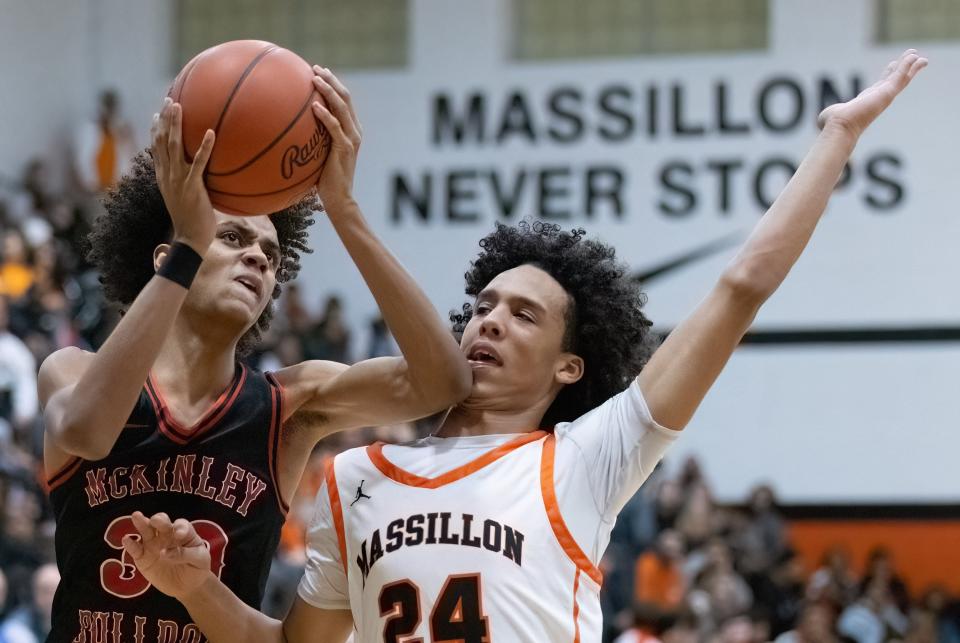 McKinley’s Reed Sims Jr. goes to the basket past Massillon’s Gio Jackson on Tuesday, Feb. 6, 2024.