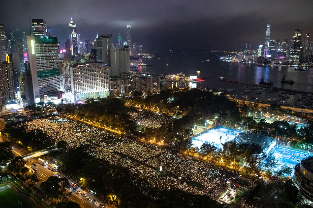 Image: andlelight vigil at Victoria Park (Philip Fong / AFP via Getty Images file)