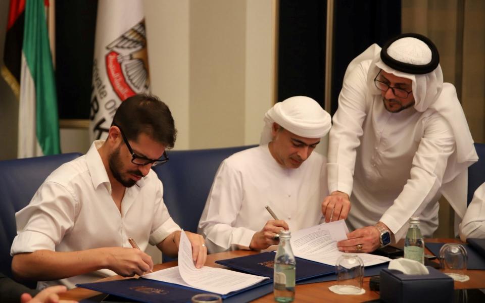 Sheikh Hamad Bin Khalifa Al Nahyan's and Beitar Jerusalem F.C. owner Moshe Hogeg sign an agreement in Dubai, United Arab Emirates December 7, 2020
