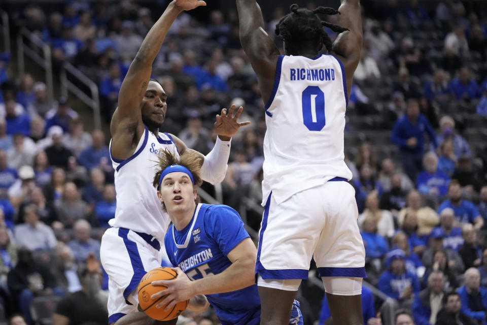 Seton Hall guard Kadary Richmond (0) and forward KC Ndefo guard Creighton guard Baylor Scheierman (55) during the first half of an NCAA college basketball game, Wednesday, Feb. 8, 2023, in Newark, N.J. (AP Photo/Mary Altaffer)