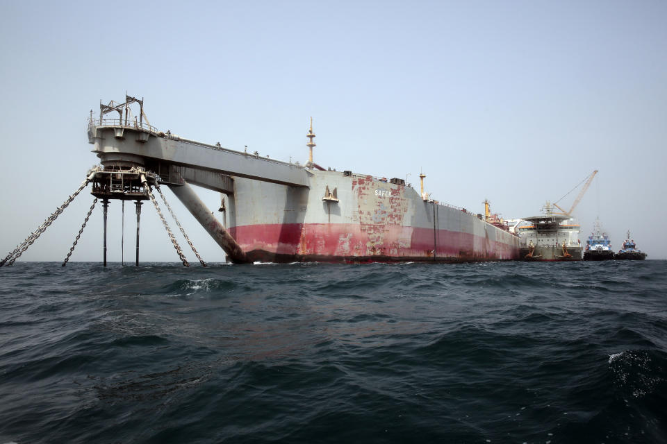 FILE - Technical vessels are seen by the decrepit 'Safer' tanker on Monday, June 12, 2023, off the coast of Yemen. A senior United Nations official says a salvage team is set to begin siphoning oil out of the decaying tanker moored off the coast of Yemen. (AP Photo/Osamah Abdulrahman, File)