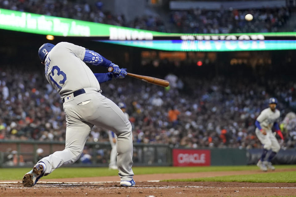 Los Angeles Dodgers' Max Muncy (13) hits a three-run home run against the San Francisco Giants during the third inning of a baseball game in San Francisco, Monday, April 10, 2023. (AP Photo/Jeff Chiu)