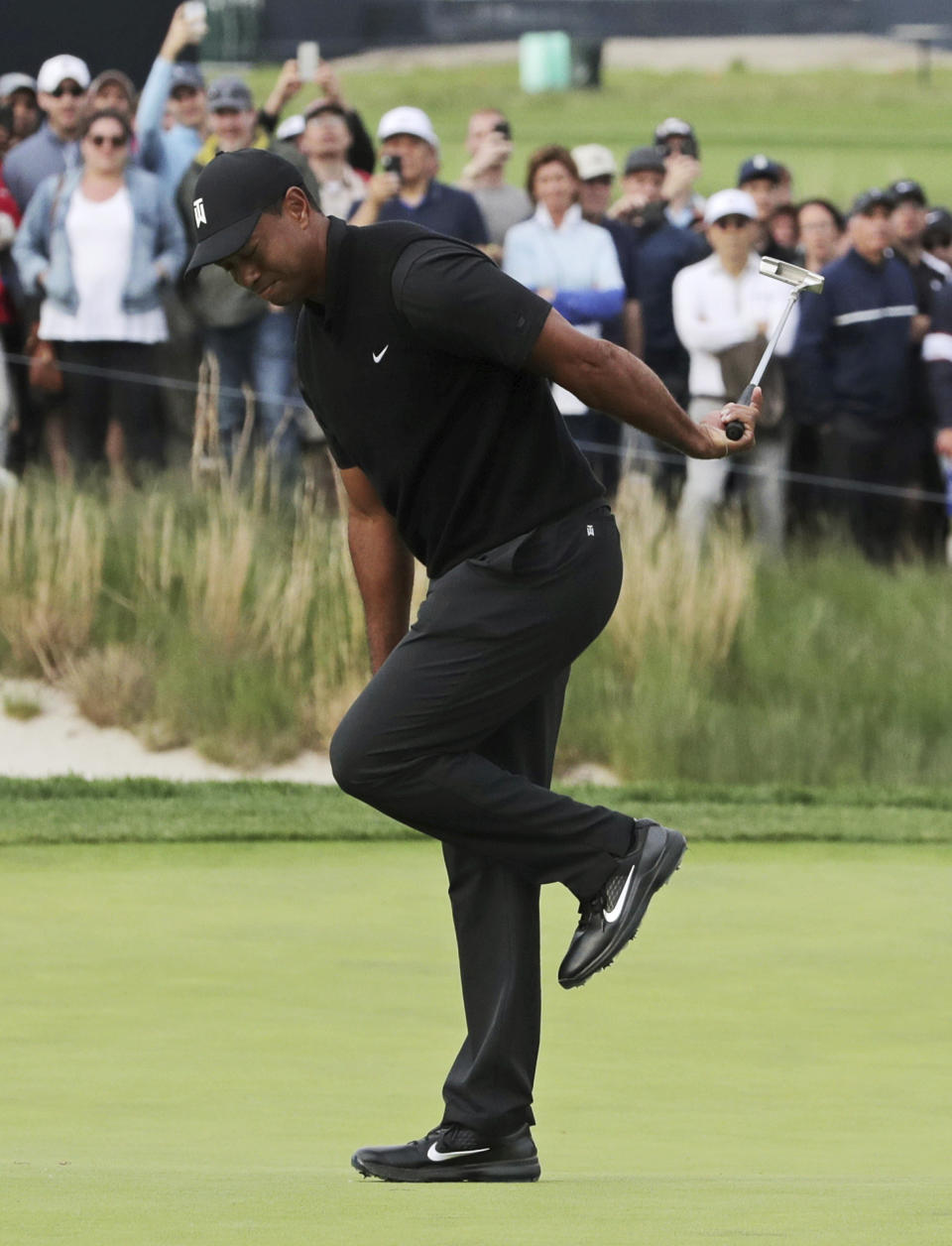 Tiger Woods reacts after missing a putt for birdie on the 17th green during the second round of the PGA Championship golf tournament, Friday, May 17, 2019, at Bethpage Black in Farmingdale, N.Y. (AP Photo/Charles Krupa)