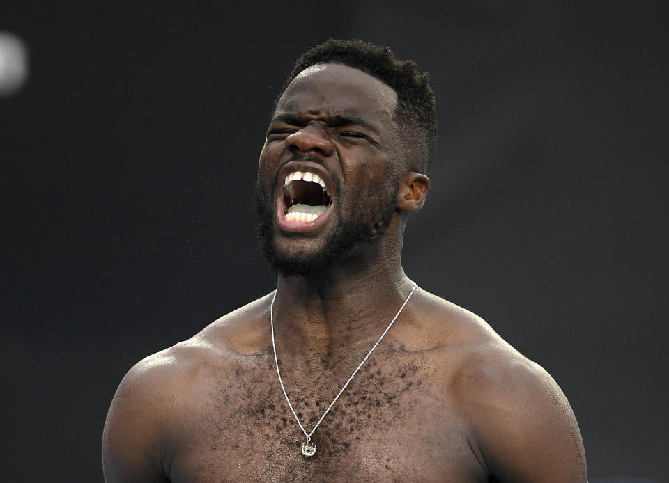 United States' Frances Tiafoe celebrates after defeating Italy's Andreas Seppi during their third round match at the Australian Open tennis championships in Melbourne, Australia, Friday, Jan. 18, 2019. (AP Photo/Andy Brownbill)