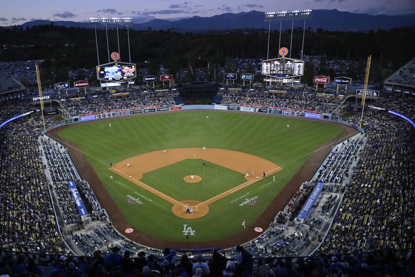 Fans watch at the Los Angeles Dodgers play the Arizona Diamondbacks in the first inning.