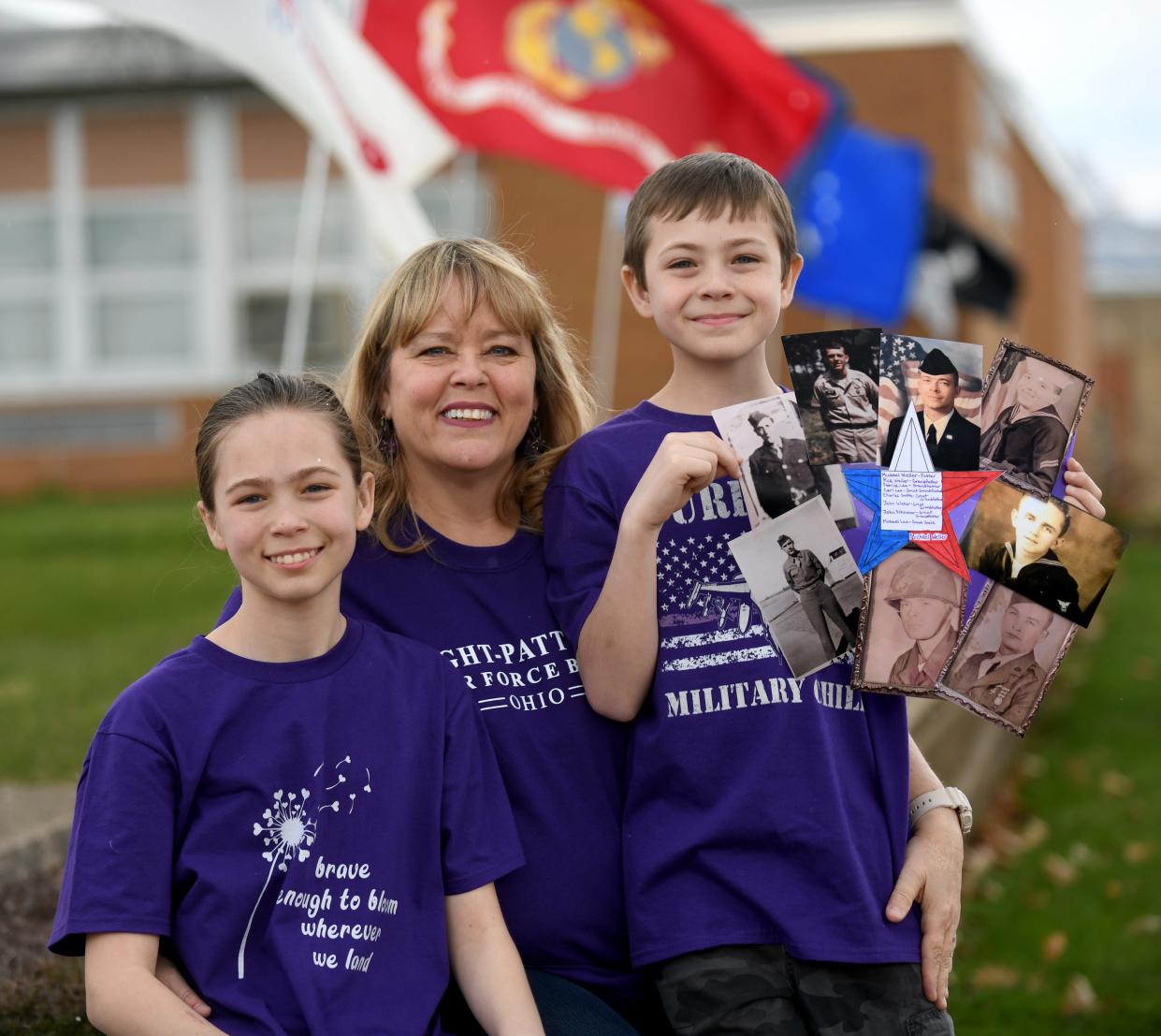 Lisa Weller with her children Kaylee, a Tuslaw Middle School fifth grader and, Michael, a third grader. Michael is proudly displaying a photo collage of their dad, Technical Sgt. Michael Weller, who is stationed at Wright-Patterson Air Force Base, and other family members who have served. Tuslaw is celebrating the Month of the Military Child throughout April honoring military children and their families.