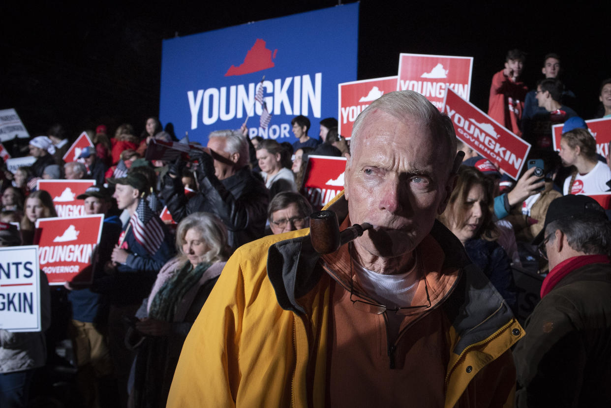 Long-time Republican supporter Jim Wilson waits for Republican gubernatorial candidate Glenn Youngkin to a arrive at a campaign rally in Leesburg, Va., Monday, Nov. 1, 2021. (AP Photo/Cliff Owen)