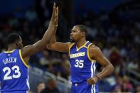 Jan 22, 2017; Orlando, FL, USA; Golden State Warriors forward Kevin Durant (35) high fives forward Draymond Green (23) against the Orlando Magic during the second half at Amway Center. Golden State Warriors defeated the Orlando Magic 118-98. Mandatory Credit: Kim Klement-USA TODAY Sports