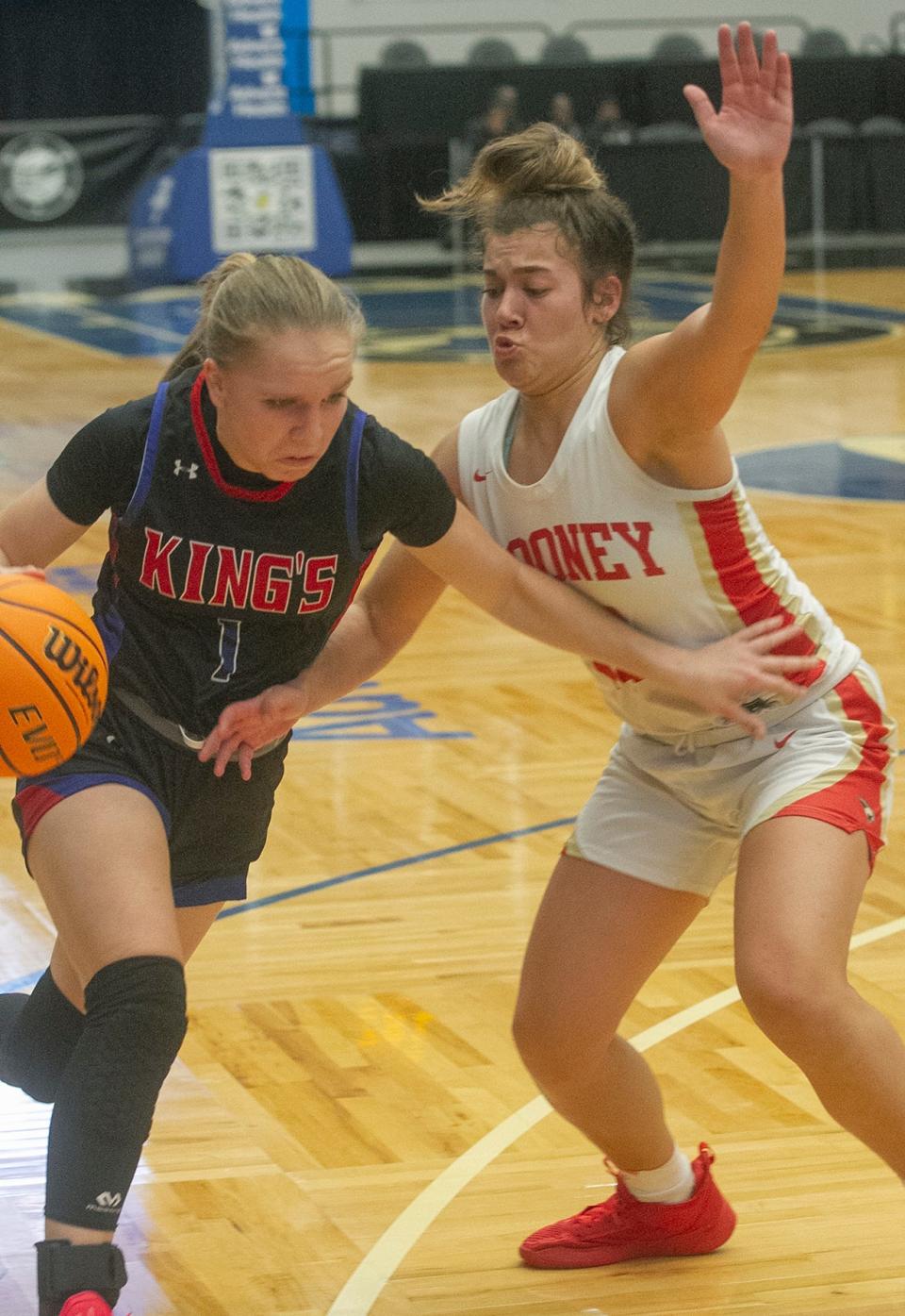 King's Academy's Sofia Rathbun (1) drives up the court as Cardinal Mooney High SchoolÕs Olivia Davis (12) tries to defend during their FHSAA Girls 3A girls semifinal basketball game at The RP Funding Center in Lakeland Wednesday. February 22, 2023. (SPECIAL TO THE PALM BEACH POST/MICHAEL WILSON)