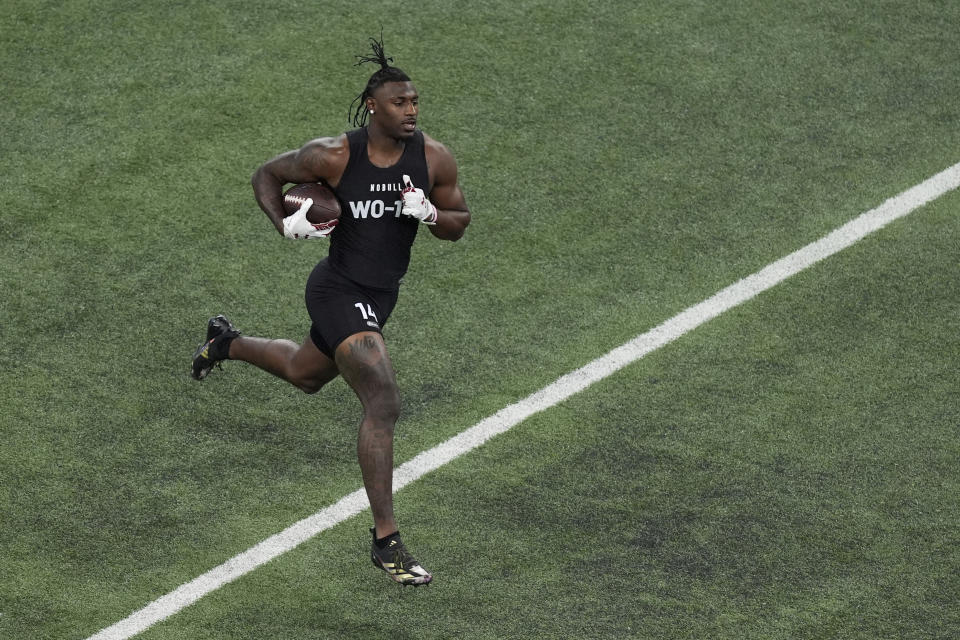 South Carolina wide receiver Xavier Legette runs the ball during the NFL football scouting combine, Saturday, March 2, 2024, in Indianapolis. (AP Photo/Charlie Riedel)