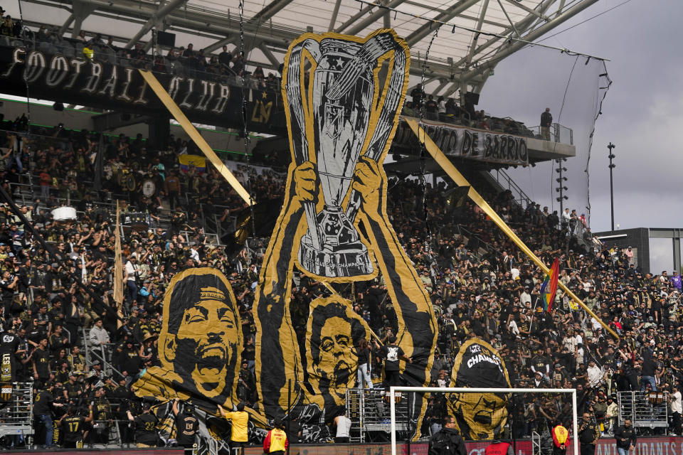 Los Angeles FC fans celebrate the team's 2022 MLS Championship title before the team's MLS soccer match against the Portland Timbers, Saturday, March 4, 2023, in Los Angeles. (AP Photo/Jae C. Hong)