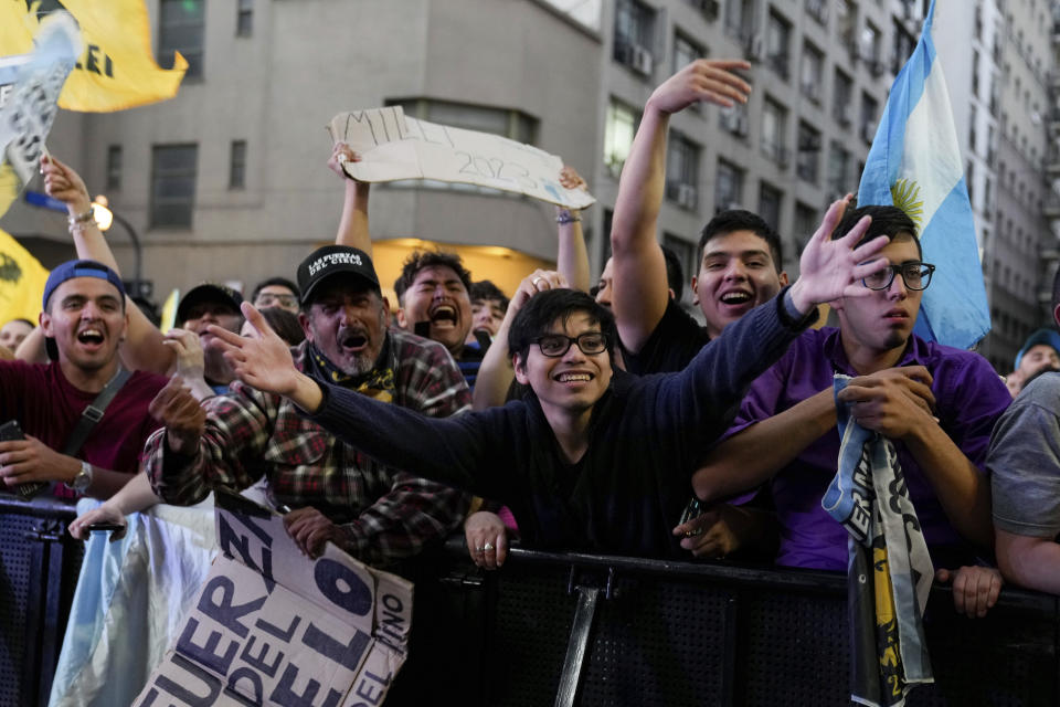 Supporters of the opposition presidential candidate Javier Milei celebrate after polls closed in the presidential runoff election in Buenos Aires, Argentina, Sunday, Nov. 19, 2023. (AP Photo/Natacha Pisarenko)