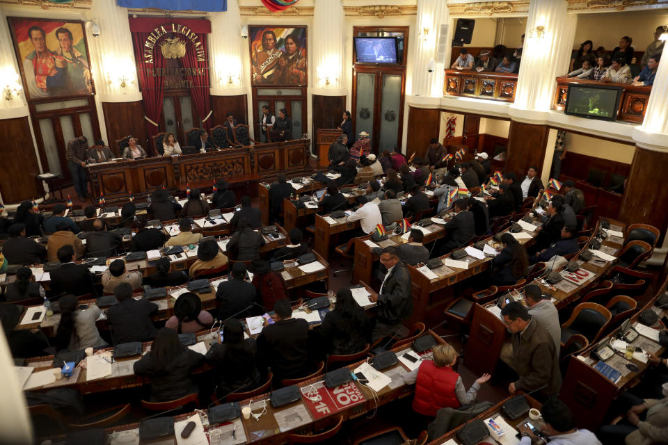 Legislators attend a session at the Chamber of Deputies in La Paz, Bolivia, Wednesday, Nov. 20, 2019. Bolivia has been in a state of turbulence since a disputed Oct. 20 vote that, according to an international audit, was marred by irregularities. Former President Evo Morales resigned Nov. 10 after protests against him and pressure from the security forces, but his supporters oppose the interim government that took his place. (AP Photo/Natacha Pisarenko)