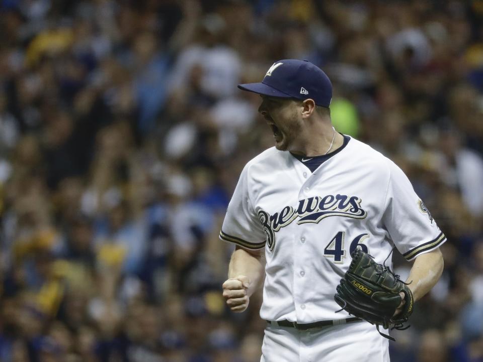Milwaukee Brewers relief pitcher Corey Knebel reacts after getting Los Angeles Dodgers' Manny Machado to strike out during the fifth inning of Game 6 of the National League Championship Series baseball game Friday, Oct. 19, 2018, in Milwaukee. (AP Photo/Matt Slocum)