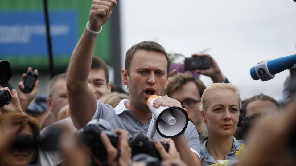Alexei Navalny, center, addresses supporters and journalists in Moscow in 2013. - Dmitry Lovetsky/AP
