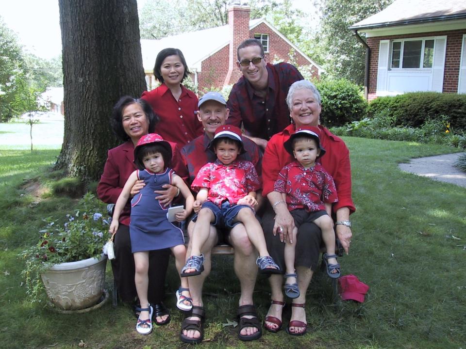 Just before moving from Northern Virginia to Indonesia in 2003: Thuan Le Elston, back left, husband Bob, mom Duc Le, parents-in-law Bob and Carol Anne Elston, daughter Thai-Binh and sons Hanh-Thien and Kien-Tam.