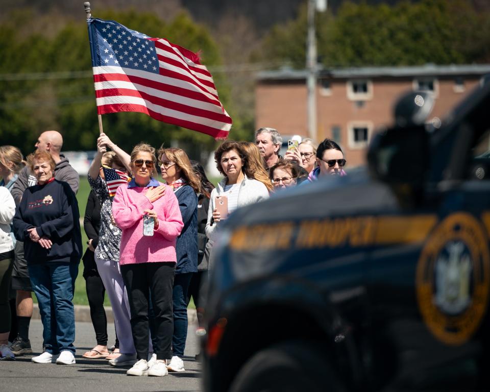 People line Turin Road in Rome, NY for fallen Syracuse Police Officer Michael Jensen on Tuesday, April 16, 2024.