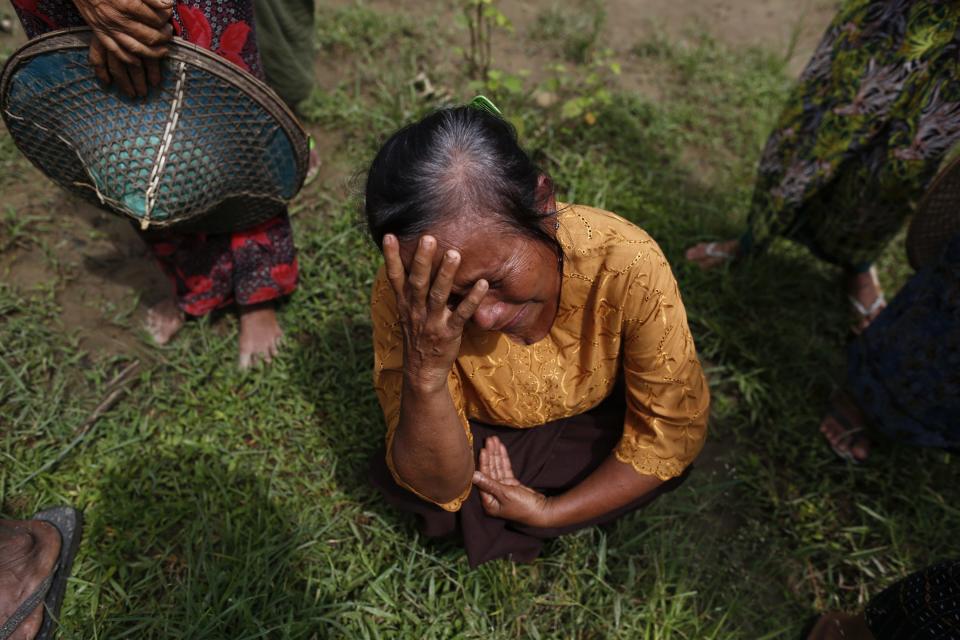 A Muslim woman, whose home was burnt down during recent violence, cries in Pauktaw village, outside of Thandwe in the Rakhine state