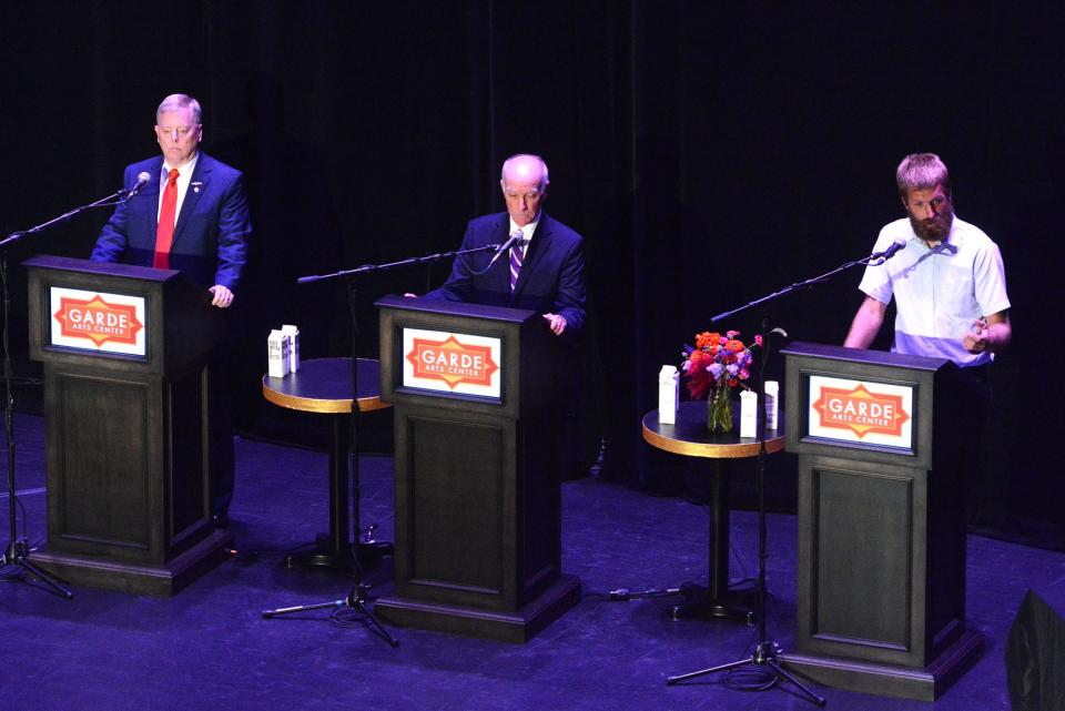 Joe Courtney, Second Congressional district incumbent Democratic U.S. representative, center, Mike France, outgoing state representative and Republican candidate, left, and Kevin Blacker, Green Party candidate, debate for the congressional seat Oct. 12, 2022 at the Garde Arts Center in New London.