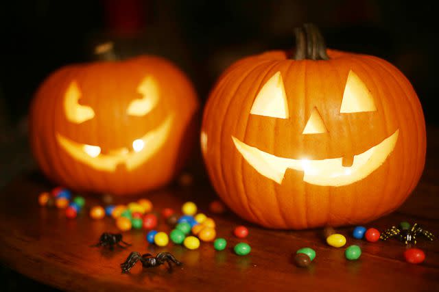 Catherine Delahaye/Digital Vision/Getty Images Halloween Pumpkins and Candy