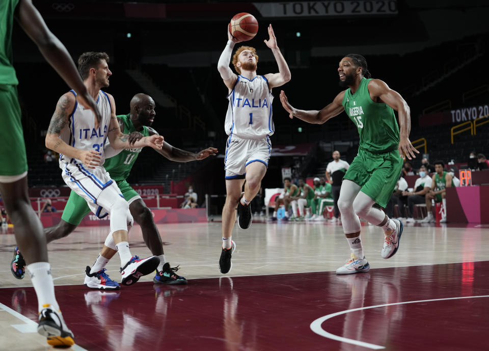 Italy's Niccolo Mannion (1), second right, drives to the basket during men's basketball preliminary round game against Nigeria at the 2020 Summer Olympics, Saturday, July 31, 2021, in Saitama, Japan. (AP Photo/Eric Gay)