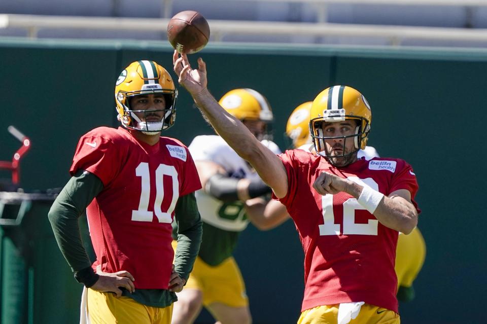 Green Bay Packers' Jordan Love watches Aaron Rodgers throw during NFL football practice Friday, Sept. 4, 2020, in Green Bay, Wis. (AP Photo/Morry Gash)