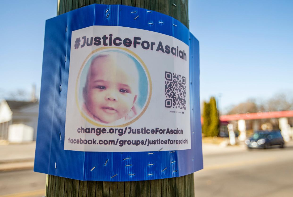 A sign posted along Portage Avenue calls for “Justice For Asaiah” on Thursday, Dec. 16, 2021, in South Bend. Six-month-old Asaiah Molik died on January.