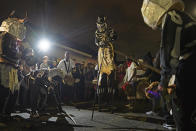 The North Side Skull & Bones Gang rises before dawn, costumed as skeletons, to wake people up on Mardi Gras Day in New Orleans, La. Tuesday, Feb. 25, 2020. The gang marches though the Treme neighborhood waking people up with song, dance and a message to love each other and be thankful for another day of life./The Advocate via AP)