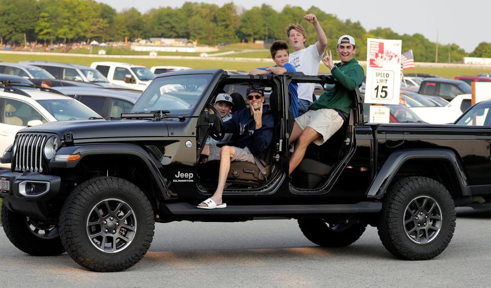 Enthusiastic fans drive on the grounds for the NASCAR race last July 4. For the first time Road America sold parking for an event.