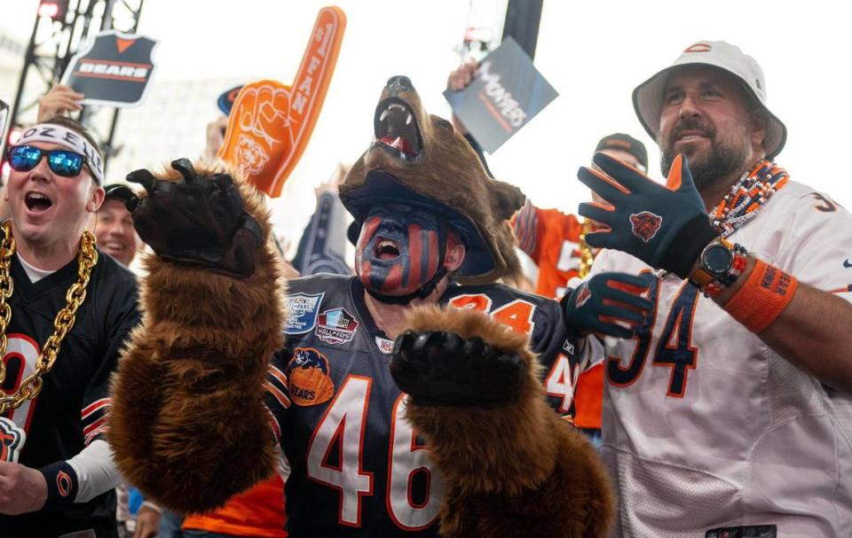 Don “Bearman” Wachter, center, cheers during the NFL Draft outside of Union Station on Thursday, April 27, 2023, in Kansas City.