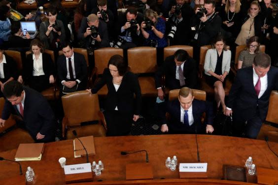 Fiona Hill and David Holmes take their seats before giving evidence at the public impeachment hearings into Donald Trump (AP)