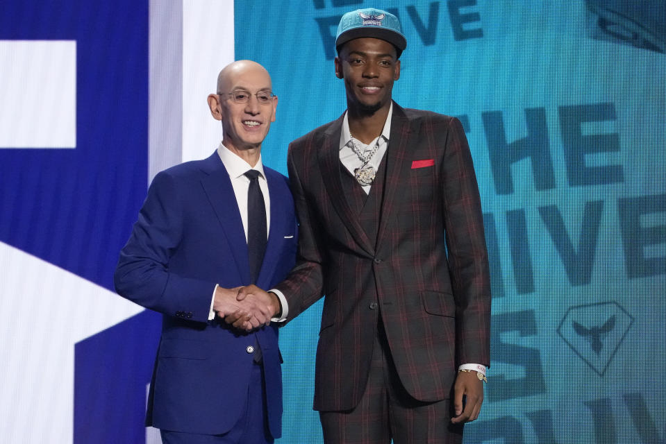 Brandon Miller with NBA commissioner Adam Silver after being selected second overall by the Charlotte Hornets during the 2023 NBA Draft on June 22, 2023, in New York. (AP Photo/John Minchillo)
