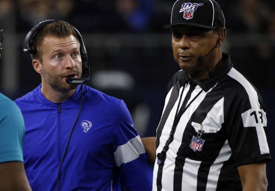 Los Angeles Rams head coach Sean McVay, left, talks with an official in the second half of an NFL football game against the Dallas Cowboys in Arlington, Texas, Sunday, Dec. 15, 2019. (AP Photo/Michael Ainsworth)